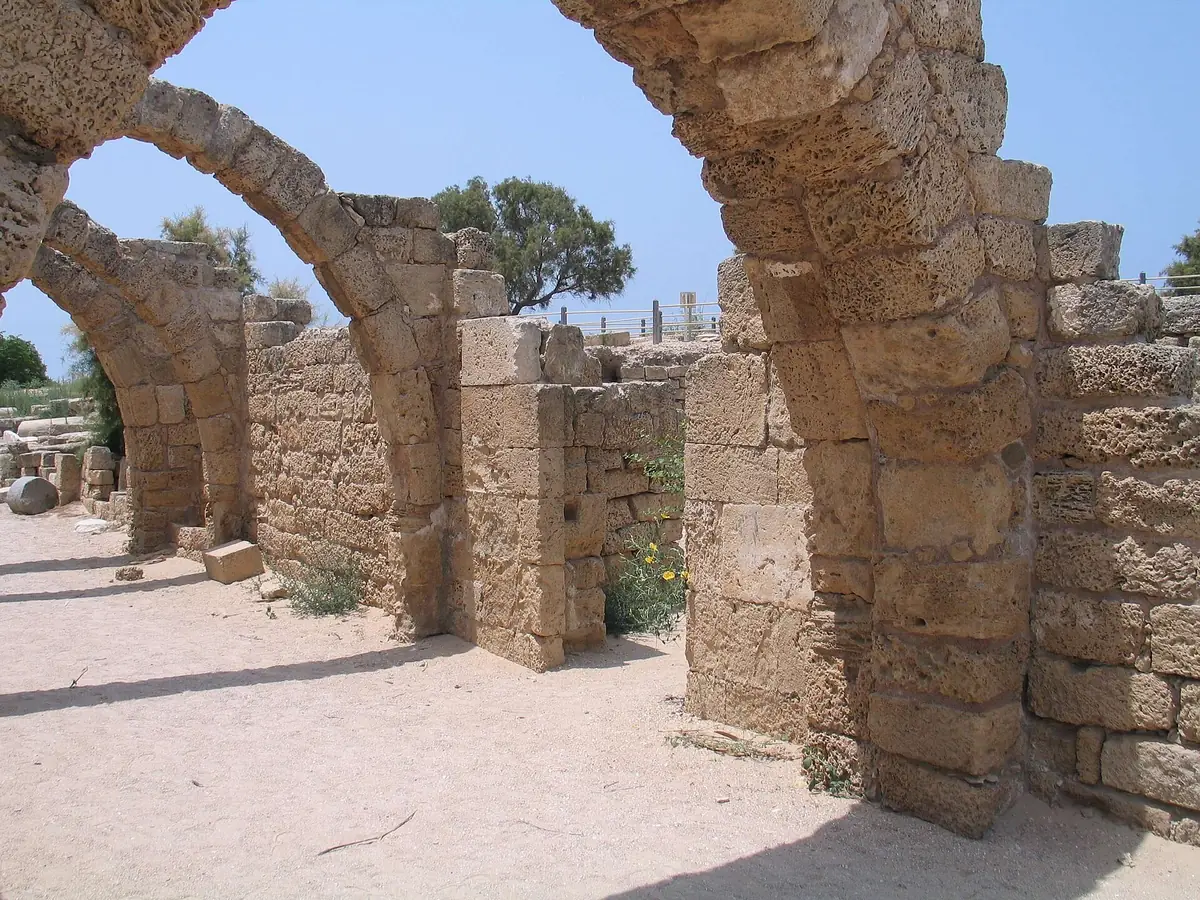A row of ancient stone arches among the ruins of Caesarea National Park